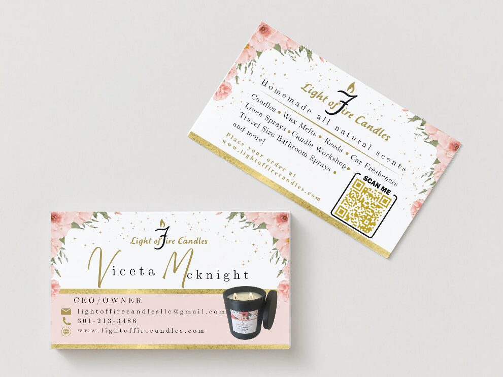 Business card with floral design, contact info, and a candle image, displayed at an angle.