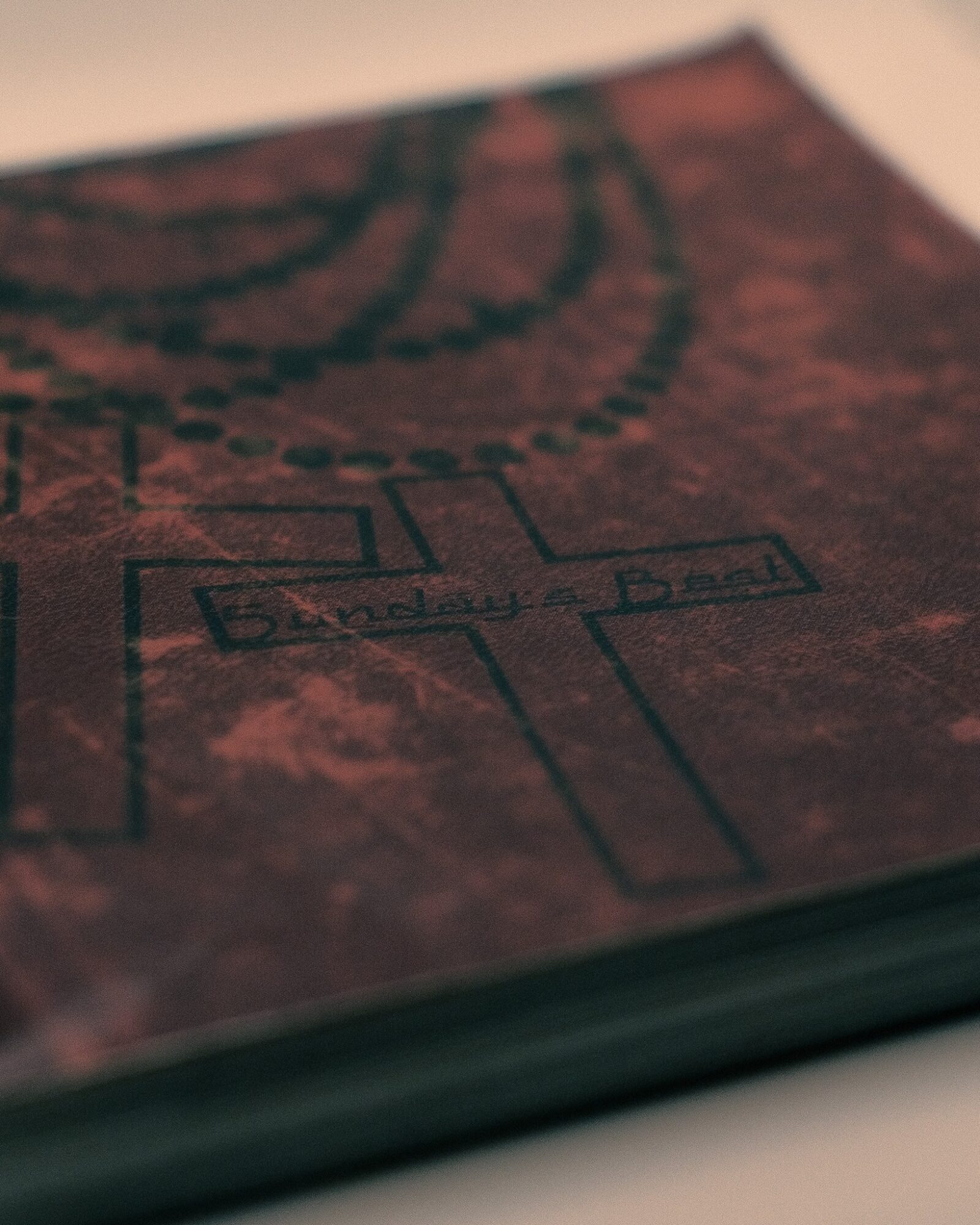 Close-up of a textured surface with a faint, partially visible diagram or map drawn on it.