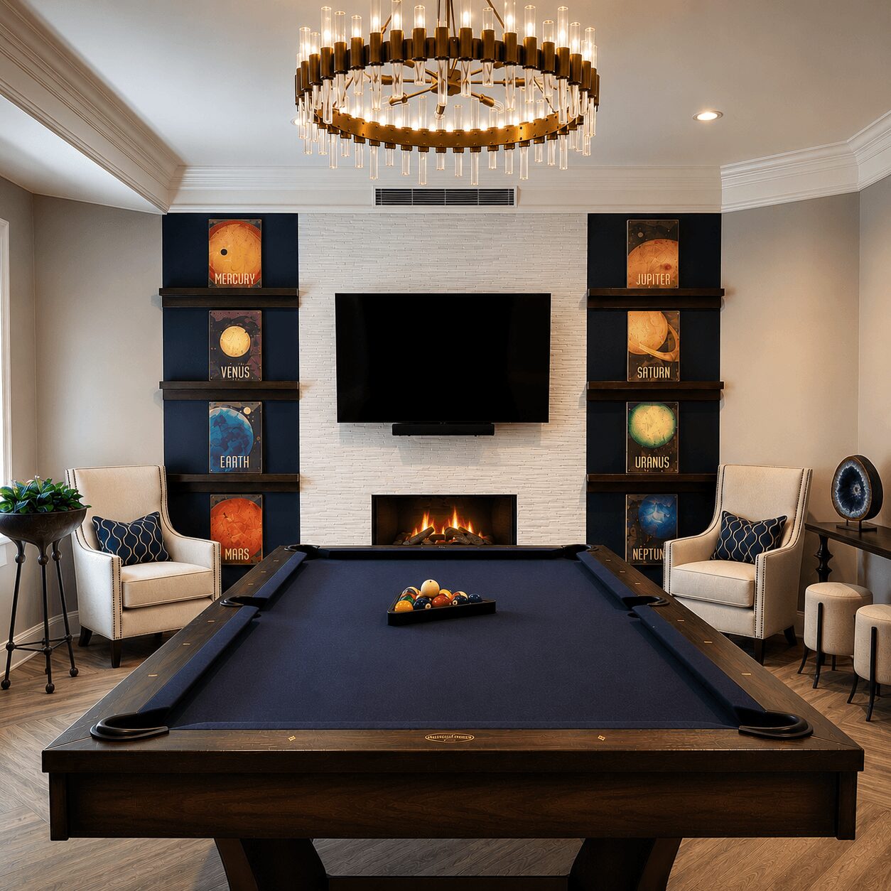 Living room with a pool table, two armchairs, a fireplace, a TV, and bookshelves, decorated with a chandelier and plants.