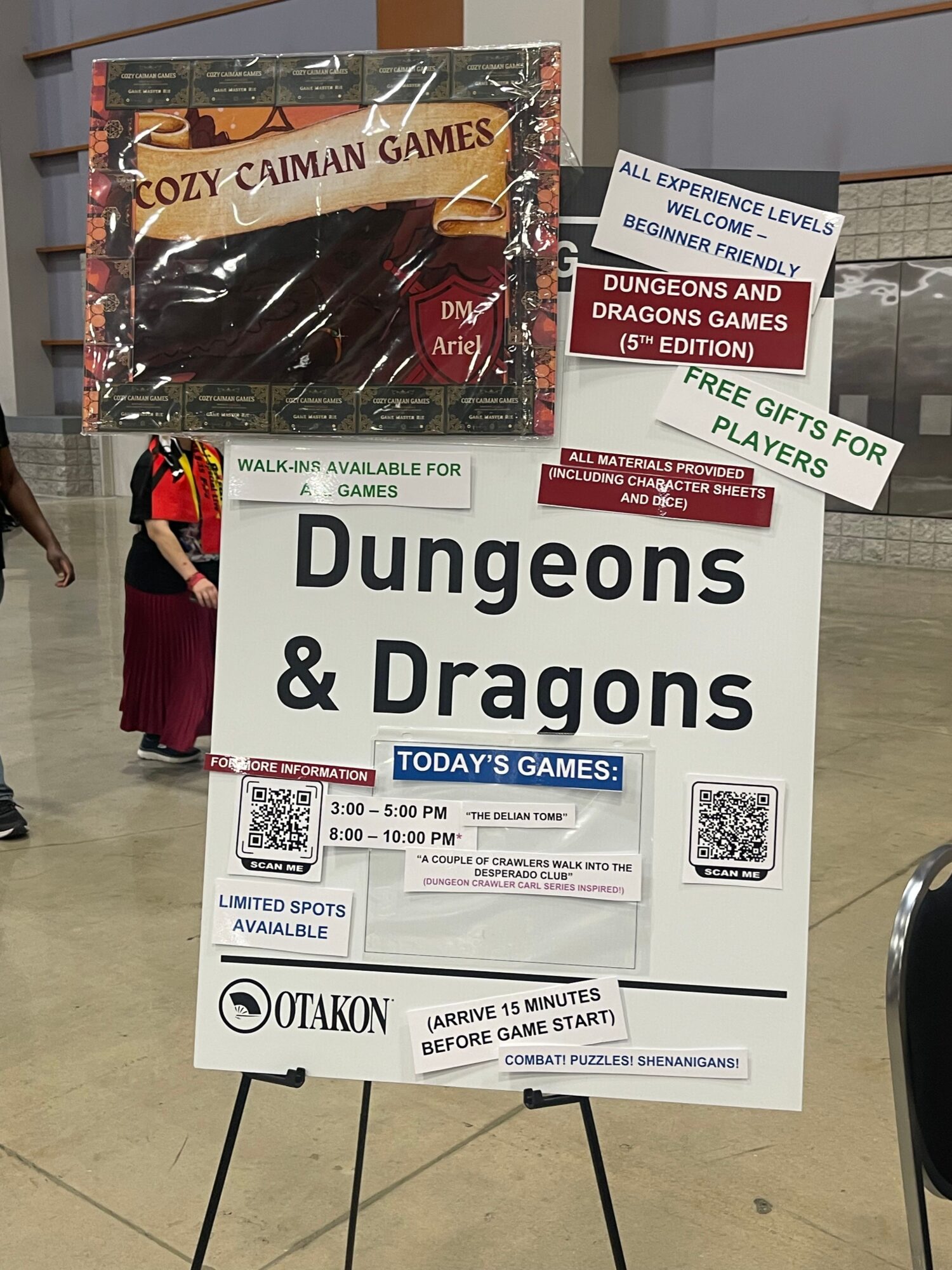Signboard advertising Dungeons & Dragons game, with promotional posters and a person in the background.